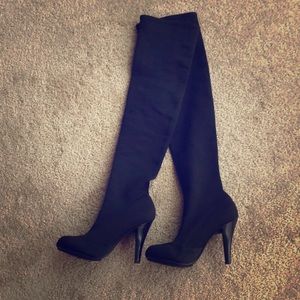 Report black stretch over the knee boot